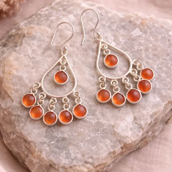 Carnelian Bezel Chandelier Earrings in 925 Sterling Silver - Multiple Orange Stones in Decorative Filigree Drop Design on Natural Background